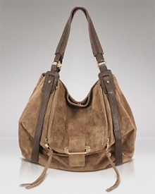 Mimicking vintage style with suede leather, this hobo bag from Kooba indulges both your bohemian style and affinity for luxury. Suede leather adds texture, punctuated by rich leather straps and an easy pouch pocket. Mimicking vintage style with suede leather, this hobo bag from Kooba indulges both your bohemian style and affinity for luxury. Suede leather adds texture, punctuated by rich leather straps and an easy pouch pocket.