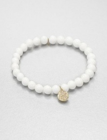 From the Discs Collection. A glossy sea clam beaded bracelet accented with a diamond accented 14k gold charm. Sea clam shells14k goldDiamonds, .12 tcwLength, about 6.5Slip-on styleImported From the Discs Collection. A glossy sea clam beaded bracelet accented with a diamond accented 14k gold charm. Sea clam shells14k goldDiamonds, .12 tcwLength, about 6.5Slip-on styleImported