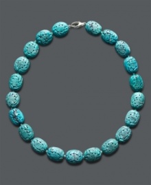 Add a little color and class. This stunning carved necklace adds a vivid pop to your look with bright turquoise beads (14 mm) and a sterling silver clasp. Approximate length: 18 inches. Add a little color and class. This stunning carved necklace adds a vivid pop to your look with bright turquoise beads (14 mm) and a sterling silver clasp. Approximate length: 18 inches.