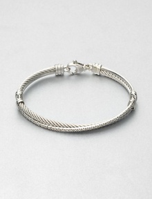 From the Crossover Collection. Iconic cable accented with a ring of pavé diamonds in an intriguing crossover design. Sterling silverDiamonds, .49 tcwDiameter, about 2.5Hinged, lobster clasp closureImported From the Crossover Collection. Iconic cable accented with a ring of pavé diamonds in an intriguing crossover design. Sterling silverDiamonds, .49 tcwDiameter, about 2.5Hinged, lobster clasp closureImported