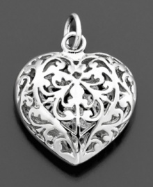 Romantic and lovely, this filigree heart charm is crafted in sterling silver. By Rembrandt Charms. Approximate drop: 3/4 inches. Romantic and lovely, this filigree heart charm is crafted in sterling silver. By Rembrandt Charms. Approximate drop: 3/4 inches.