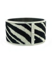 The sweet contrast of black and white creates a look that's both wild and wearable. Vince Camuto's chic cuff bracelet is crafted in silver tone mixed metal with a zebra print pony skin surface. Approximate diameter: 2 inches. The sweet contrast of black and white creates a look that's both wild and wearable. Vince Camuto's chic cuff bracelet is crafted in silver tone mixed metal with a zebra print pony skin surface. Approximate diameter: 2 inches.