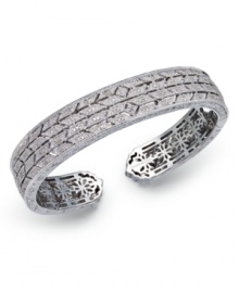 Deck yourself out in diamonds. This exquisite bangle features a cut-out pattern decorated with round-cut diamonds (5/8 ct. t.w.). Set in sterling silver. Approximate diameter 2-1/2 inches. Deck yourself out in diamonds. This exquisite bangle features a cut-out pattern decorated with round-cut diamonds (5/8 ct. t.w.). Set in sterling silver. Approximate diameter 2-1/2 inches.