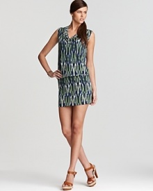 Cool tones stretch from cowl neckline to high hemline on this MICHAEL Michael Kors dress, abundant with a vibrant tribal print. Accentuate the exotic element with strappy leather sandals. Cool tones stretch from cowl neckline to high hemline on this MICHAEL Michael Kors dress, abundant with a vibrant tribal print. Accentuate the exotic element with strappy leather sandals.