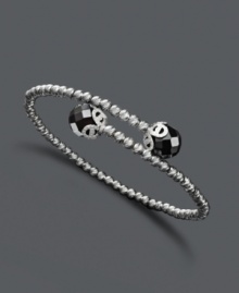 Give your look a bold edge. Wrapped cuff bracelet features a sterling silver sparkle bead setting with polished onyx ball ends (7-2/8 mm). Approximate length: 7-1/2 inches. Give your look a bold edge. Wrapped cuff bracelet features a sterling silver sparkle bead setting with polished onyx ball ends (7-2/8 mm). Approximate length: 7-1/2 inches.