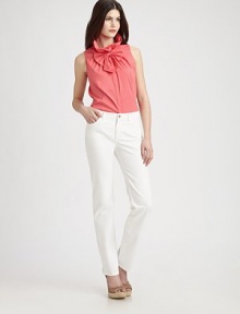 The new classic, a well-tailored design with an undeniably feminine air, thanks to a removable bow and flattering Princess seams. Gathered detail at stand collarSleevelessHidden button placketRemovable bowPrincess seamsAbout 24 from shoulder to hem72% cotton/23% polyamide/5% Lycra®Machine washImported of Italian fabric Model shown is 5'10 (177cm) wearing US size 4. 