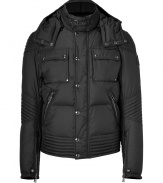 Bundle up in ultra luxe style in Belstaffs jet black quilted down jacket - Belted stand-up collar, long sleeves, zippered snapped cuffs, hidden front zip with snap panel, zippered slit and patch pockets, biker-inspired quilting at elbows and hemline, black leather accents throughout - Modern slim fit - Wear with favorite jeans and cool fashion sneakers