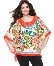 A vibrant burst of color and a flowing cut make ECI's poncho your new go-to top! A vibrant burst of color and a flowing cut make ECI's poncho your new go-to top!