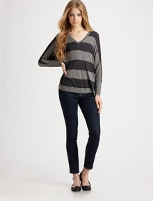 Bold stripes highlight this slouchy dropped-shoulder silhouette.V neckline Long sleeves Wide cuffs Pullover style About 25½ from shoulder to hem 85% viscose/15% wool Dry clean Made in USA of imported fabric Bold stripes highlight this slouchy dropped-shoulder silhouette.V neckline Long sleeves Wide cuffs Pullover style About 25½ from shoulder to hem 85% viscose/15% wool Dry clean Made in USA of imported fabric