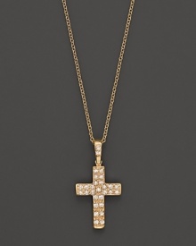 Petite diamond pavé-set cross pendant set in 14K yellow gold. Petite diamond pavé-set cross pendant set in 14K yellow gold.