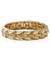 Chevrons star in this stretch bracelet from Fossil. Crafted from gold-tone mixed metal. Approximate diameter: 2-1/4 inches.