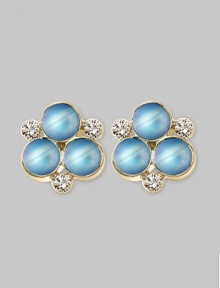 The lovely iridescence of cabochon moonstones, clustered amid diamond accents, gives these delicate earrings the feeling of being lit from within. Diamonds, 0.18 tcw Moonstone 18k yellow gold Length, about ½ Post back Made in Italy