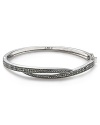 Judith Jack proves simple style can have an edge with this sterling silver bangle. Dipped in marcasite stones, it's crossover design adds seductive sparkle.