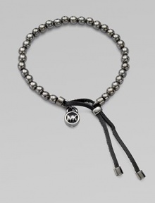 A smooth, beaded design with a logo lock charm and an adjustable leather closure. Gunmetal-finished metalDiameter, about 2.5Slip-on style with adjustable leather closureImported A smooth, beaded design with a logo lock charm and an adjustable leather closure. Gunmetal-finished metalDiameter, about 2.5Slip-on style with adjustable leather closureImported