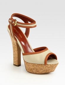 Lifted by a cork heel and platform, breathable canvas is topped with rich Italian leather trim and an adjustable ankle strap. Cork heel, 5 (125mm)Cork platform, 1 (25mm)Compares to a 4 heel (100mm)Canvas and leather upperLeather lining and solePadded insoleMade in ItalyOUR FIT MODEL RECOMMENDS ordering true size. Lifted by a cork heel and platform, breathable canvas is topped with rich Italian leather trim and an adjustable ankle strap. Cork heel, 5 (125mm)Cork platform, 1 (25mm)Compares to a 4 heel (100mm)Canvas and leather upperLeather lining and solePadded insoleMade in ItalyOUR FIT MODEL RECOMMENDS ordering true size.