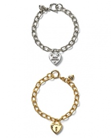 Just what she wants this year... a Juicy Couture starter bracelet that comes the perfect first charm:a puffy heart lock. Shown with iconic Juicy script and glass crystal accents. Just what she wants this year... a Juicy Couture starter bracelet that comes the perfect first charm:a puffy heart lock. Shown with iconic Juicy script and glass crystal accents.