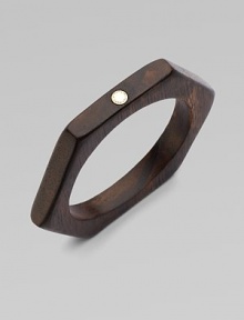 This geometric design features a natural wood body with a metal logo accent. WoodGoldtone zincDiameter, about 3.6Slip-on styleImported This geometric design features a natural wood body with a metal logo accent. WoodGoldtone zincDiameter, about 3.6Slip-on styleImported