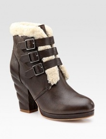 Soft leather look with a uniquely twisted heel, a trio of buckles and plush shearling trim. Self-covered heel, 4 (100mm) Covered platform, ½ (15mm) Compares to a 3½ heel (90mm) Leather and shearling upper Leather lining and sole Padded insole Imported Soft leather look with a uniquely twisted heel, a trio of buckles and plush shearling trim. Self-covered heel, 4 (100mm) Covered platform, ½ (15mm) Compares to a 3½ heel (90mm) Leather and shearling upper Leather lining and sole Padded insole Imported