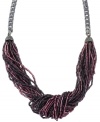 Dramatic decor. Jessica Simpson's chic knotted necklace combines multiple strands of acrylic beads in a palette of deep purple and pink. Set in silver tone mixed metal. Approximate length: 17 inches.