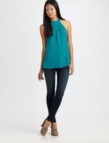 Gorgeous silk chiffon crafted in a feminine halter silhouette.Halter strap ties at neck Pleats at bodice Mesh back panel Center back zipper About 26 from shoulder to hem 93% silk/7% spandex Dry clean Imported Gorgeous silk chiffon crafted in a feminine halter silhouette.Halter strap ties at neck Pleats at bodice Mesh back panel Center back zipper About 26 from shoulder to hem 93% silk/7% spandex Dry clean Imported