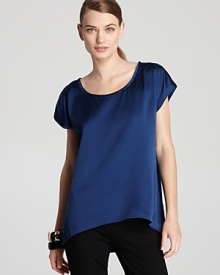 Sumptuous silk lends elegant movement to a vibrant Eileen Fisher blouse. Let the style pop against crisp, black suiting for corner-office chic. Sumptuous silk lends elegant movement to a vibrant Eileen Fisher blouse. Let the style pop against crisp, black suiting for corner-office chic.