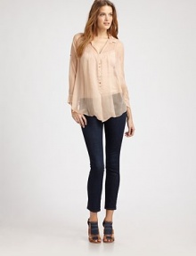 Delightfully sheer, this floaty silk button-down is slightly oversized with delicate stitched pleating at the neck.Point collarSlightly dropped shouldersButton-down frontRoll-tab sleevesFlared hem, shorter in backAbout 26 from shoulder to hemSilkDry cleanMade in USAModel shown is 5'9 (175cm) wearing US size Small. Delightfully sheer, this floaty silk button-down is slightly oversized with delicate stitched pleating at the neck.Point collarSlightly dropped shouldersButton-down frontRoll-tab sleevesFlared hem, shorter in backAbout 26 from shoulder to hemSilkDry cleanMade in USAModel shown is 5'9 (175cm) wearing US size Small.