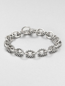 From the Chain Collection. Chunky oval links alternate between cable and smooth in this simple yet sophisticated style.Sterling silverLength, about 7.5Hidden spring clip claspMade in USA