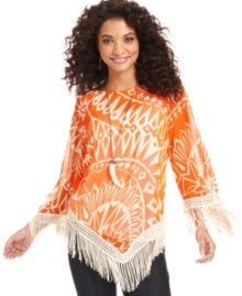 Reinvent your look with Cha Cha Vente's statement-making top, featuring a bold, bright print and fringe trim. Reinvent your look with Cha Cha Vente's statement-making top, featuring a bold, bright print and fringe trim.