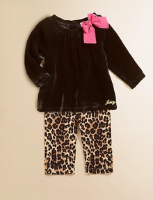 A plush velour tunic is adorned with a standout bow and Juicy signature and paired with cheetah-printed leggings for a wild ensemble.Round neckline with bowLong sleevesBack buttonsGathered bodicelLogo on hemElastic waistbandAnkle button detailCotton/SpandexMachine washImported Please note: Number of buttons may vary depending on size ordered. A plush velour tunic is adorned with a standout bow and Juicy signature and paired with cheetah-printed leggings for a wild ensemble.Round neckline with bowLong sleevesBack buttonsGathered bodicelLogo on hemElastic waistbandAnkle button detailCotton/SpandexMachine washImported Please note: Number of buttons may vary depending on size ordered.