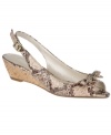 Equal parts dainty and daring, the Uta demi wedges by Etienne Aigner are an elegant option for warm-weather dressing with their sophisticated finish and low, cork heel.