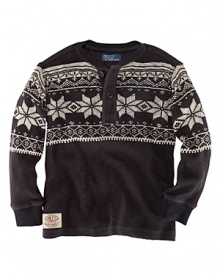 A classic henley design rendered in soft ribbed cotton is embellished with a graphic fairisle print for a festive, wintertime look. A classic henley design rendered in soft ribbed cotton is embellished with a graphic fairisle print for a festive, wintertime look.