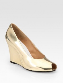Metallic leather design with a substantial wedge and subtle peep toe. Self-covered wedge, 3½ (90mm)Metallic leather upperLeather lining and solePadded insoleMade in ItalyOUR FIT MODEL RECOMMENDS ordering true size. Metallic leather design with a substantial wedge and subtle peep toe. Self-covered wedge, 3½ (90mm)Metallic leather upperLeather lining and solePadded insoleMade in ItalyOUR FIT MODEL RECOMMENDS ordering true size.