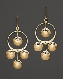Hammered 14K. yellow gold discs dance and dangle from slim hoops. Hammered 14K. yellow gold discs dance and dangle from slim hoops.