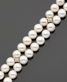 Always classic, the pearl bracelet is the perfect choice for special occasions. Luminous white cultured freshwater pearls measuring 5x5.5mm accented with dazzling diamonds set in 14k gold. Length measures 7 inches. Always classic, the pearl bracelet is the perfect choice for special occasions. Luminous white cultured freshwater pearls measuring 5x5.5mm accented with dazzling diamonds set in 14k gold. Length measures 7 inches.