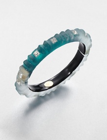 From the Lucite Teatro Modern Collection. A slender bangle of hand-sculpted, hand-painted Lucite has an intiguing ribbed textured, studded with faceted square Swarovski crystals.CrystalLuciteDiameter, about 2½Width, about ¼Hinged, with magnetic closureMade in USA From the Lucite Teatro Modern Collection. A slender bangle of hand-sculpted, hand-painted Lucite has an intiguing ribbed textured, studded with faceted square Swarovski crystals.CrystalLuciteDiameter, about 2½Width, about ¼Hinged, with magnetic closureMade in USA