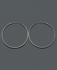 A wardrobe staple that outlives seasons, trends and time. Crafted in sterling silver, endless hoop earrings by Unwritten hook invisibly. Approximate diameter: 2-1/4 inches.