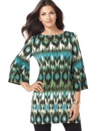 Feast your eyes on this printed tunic from Alfani. It's an eye-catching number that gets a glam touch with a studded neckline. Feast your eyes on this printed tunic from Alfani. It's an eye-catching number that gets a glam touch with a studded neckline.