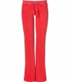 Styled this season with a slightly wider waistband and slimmer cut around the knee, Juicy Coutures iconic pants fit better now than ever! - Drawstring waistline, flared leg, snapped back pockets, shiny gold-toned hardware - Figure-hugging fit, sits low on the hips - Style with a tee and cozy pullover, or for a sportier look, with a matching hoodie and flats