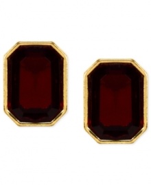 Red and gold lend a look of vibrant elegance. These stud earrings from Anne Klein features faceted red stones in a golden setting. Crafted in gold tone mixed metal. Approximate diameter: 1/2 inch. Red and gold lend a look of vibrant elegance. These stud earrings from Anne Klein features faceted red stones in a golden setting. Crafted in gold tone mixed metal. Approximate diameter: 1/2 inch.