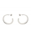 Express yourself with the simpler things in life. Subtle hoops by Kenneth Cole New York feature a 3/4 shape and post setting in silver tone mixed metal. Approximate diameter: 1 inch.