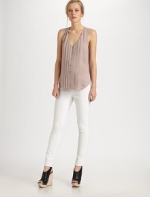 Tuxedo-inspired silk v-neck with pintucking and convenient button closures. V-neckButton frontSleevelessFront pintuckingSilkDry cleanImportedModel shown is 5'10 (177cm) wearing US size small. Tuxedo-inspired silk v-neck with pintucking and convenient button closures. V-neckButton frontSleevelessFront pintuckingSilkDry cleanImportedModel shown is 5'10 (177cm) wearing US size small.