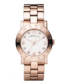 Ravishing in rose. Light up the room with the Amy watch from Marc by Marc Jacobs. Rose gold ion-plated stainless steel bracelet and round case. Bezel embossed with logo. White dial features rose-gold tone numerals at twelve, three, six and nine o'clock, crystal accents at markers, three hands and text logo. Quartz movement. Water resistant to 30 meters. Two-year limited warranty. Ravishing in rose. Light up the room with the Amy watch from Marc by Marc Jacobs. Rose gold ion-plated stainless steel bracelet and round case. Bezel embossed with logo. White dial features rose-gold tone numerals at twelve, three, six and nine o'clock, crystal accents at markers, three hands and text logo. Quartz movement. Water resistant to 30 meters. Two-year limited warranty.