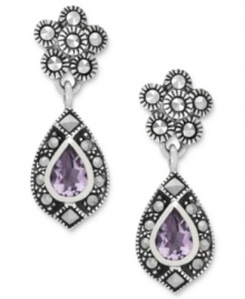Shapely sophistication. Genevieve & Grace's teardrop earrings, crafted from sterling silver, get a vibrant touch with marcasite and stunning amethyst (5/8 ct. t.w.). Approximate drop length: 1-1/8 inches. Approximate width: 3/8 inch. Shapely sophistication. Genevieve & Grace's teardrop earrings, crafted from sterling silver, get a vibrant touch with marcasite and stunning amethyst (5/8 ct. t.w.). Approximate drop length: 1-1/8 inches. Approximate width: 3/8 inch.