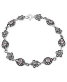 Beauty is in bloom. Genevieve & Grace's link bracelet, crafted from sterling silver, features a flower motif with marcasite and amethyst (1/10 ct. t.w.) enhancing the appeal. Approximate length: 7-1/2 inches. Beauty is in bloom. Genevieve & Grace's link bracelet, crafted from sterling silver, features a flower motif with marcasite and amethyst (1/10 ct. t.w.) enhancing the appeal. Approximate length: 7-1/2 inches.