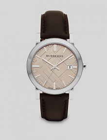A sleek, sophisticated design set in stainless steel with leather strap and check-inspired dial.Round bezelQuartz movementWater resistant to 5ATMDate function at 3 o'clockSecond handStainless steel case: 38mm(1.49)Leather strapMade in Switzerland