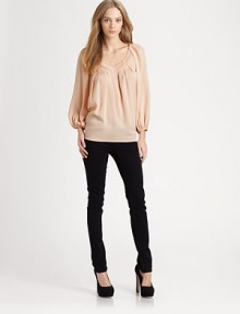 Versatile silk go-to with delicate pleats and bishop sleeves. V-neckBracelet sleeves95% silk/5% spandexDry cleanImportedModel shown is 5'9 (176cm) wearing US size 4. Versatile silk go-to with delicate pleats and bishop sleeves. V-neckBracelet sleeves95% silk/5% spandexDry cleanImportedModel shown is 5'9 (176cm) wearing US size 4.