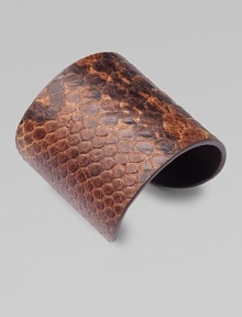 This lovely, python-print style feature a wide design for an impactful look. Python-print leatherMetal baseDiameter, about 2½Slip-on styleImported This lovely, python-print style feature a wide design for an impactful look. Python-print leatherMetal baseDiameter, about 2½Slip-on styleImported