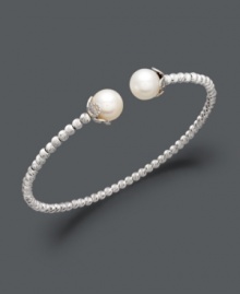 Add class to any look with polished pearls and a touch of shimmer. This sterling silver bangle bracelet features a unique beaded design that highlights two cultured freshwater pearls (8-1/2-9 mm) at the ends. Approximate diameter: 2-1/2 inches. Add class to any look with polished pearls and a touch of shimmer. This sterling silver bangle bracelet features a unique beaded design that highlights two cultured freshwater pearls (8-1/2-9 mm) at the ends. Approximate diameter: 2-1/2 inches.