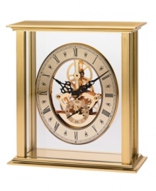 Watch as the gears shift inside this revealing tabletop clock by Bulova. A brass-finished metal frame houses a floating gold tone skeleton dial with black Roman numerals and two hands.