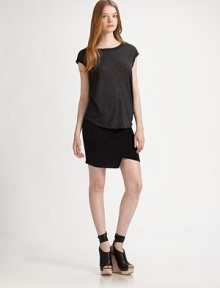 The perfect layering piece - smooth fabric with a contemporary rounded hem. BoatneckShort cap sleevesU-shaped hem60% cotton/40% polyesterDry cleanMade in USAModel shown is 5'10 (177cm) wearing US size Small. The perfect layering piece - smooth fabric with a contemporary rounded hem. BoatneckShort cap sleevesU-shaped hem60% cotton/40% polyesterDry cleanMade in USAModel shown is 5'10 (177cm) wearing US size Small.